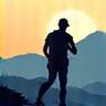 Icon representing a person hiking on a mountain trail